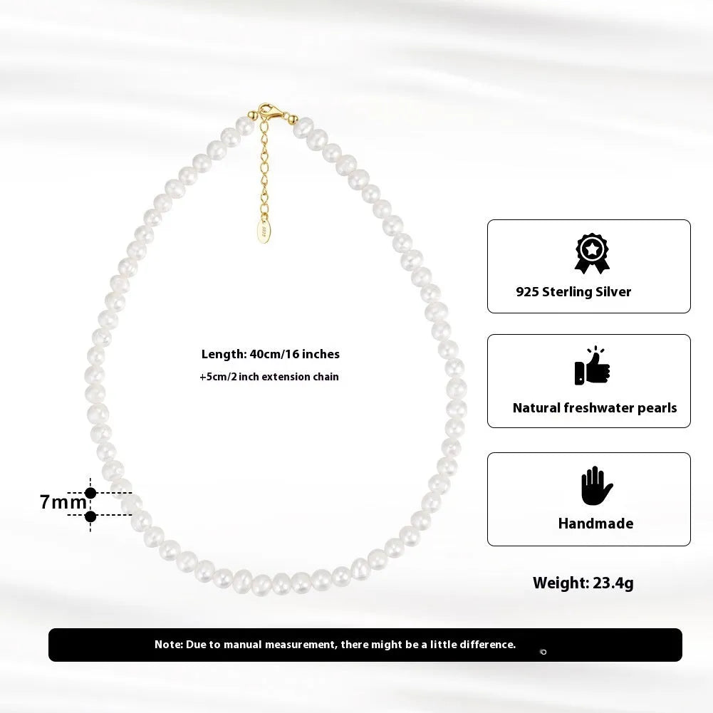 Adjustable silver necklace with a string of freshwater pearls on a model