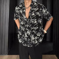 Women's loose casual short-sleeve shirt with a floral print pattern in white or black.