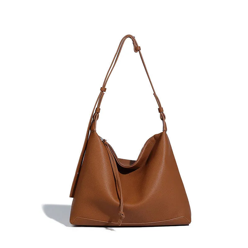 Large soft PU messenger bag in caramel colour showing 36cm length and shoulder strap