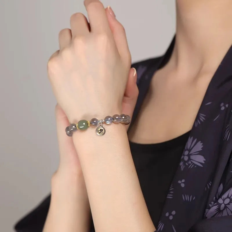 Moonstone Buddha beads bracelet with electroplated Guanyin mouse design on 8mm crystal bead