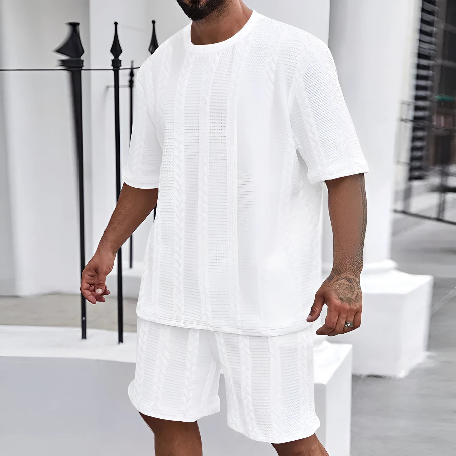 Knitted short sleeve pullover and matching shorts set in a solid colour with jacquard pattern.