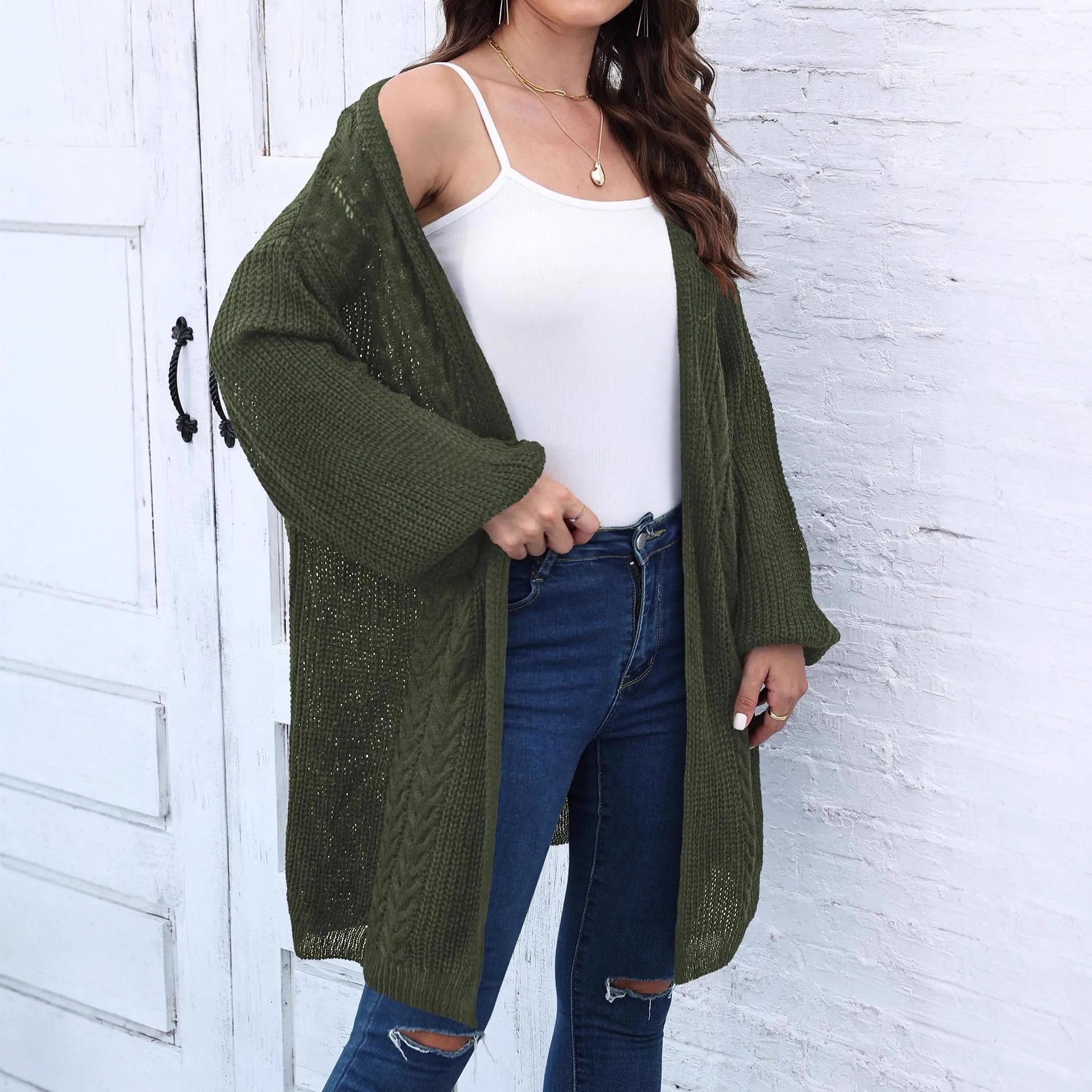 Women's loose acrylic sweater coat cardigan in army green colour, shown on a hanger.