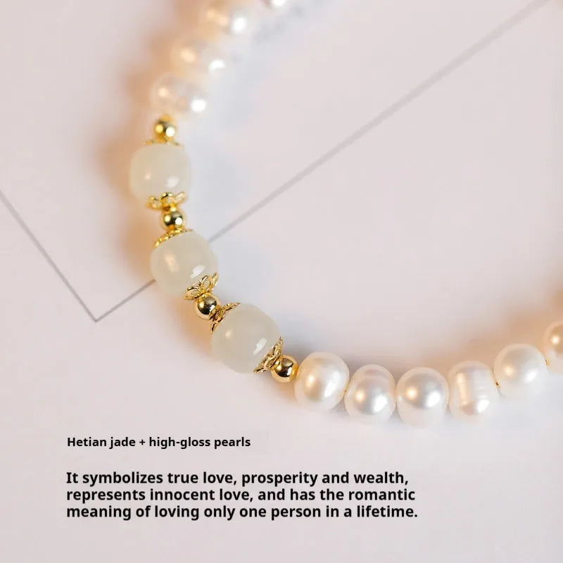 Natural freshwater pearl bracelet with diamond-shaped beads in Hetian jade colours on wrist