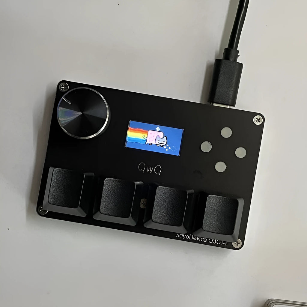 Magnetic axis gaming numeric keypad with colour screen, control knob, and RGB backlighting on a desk.