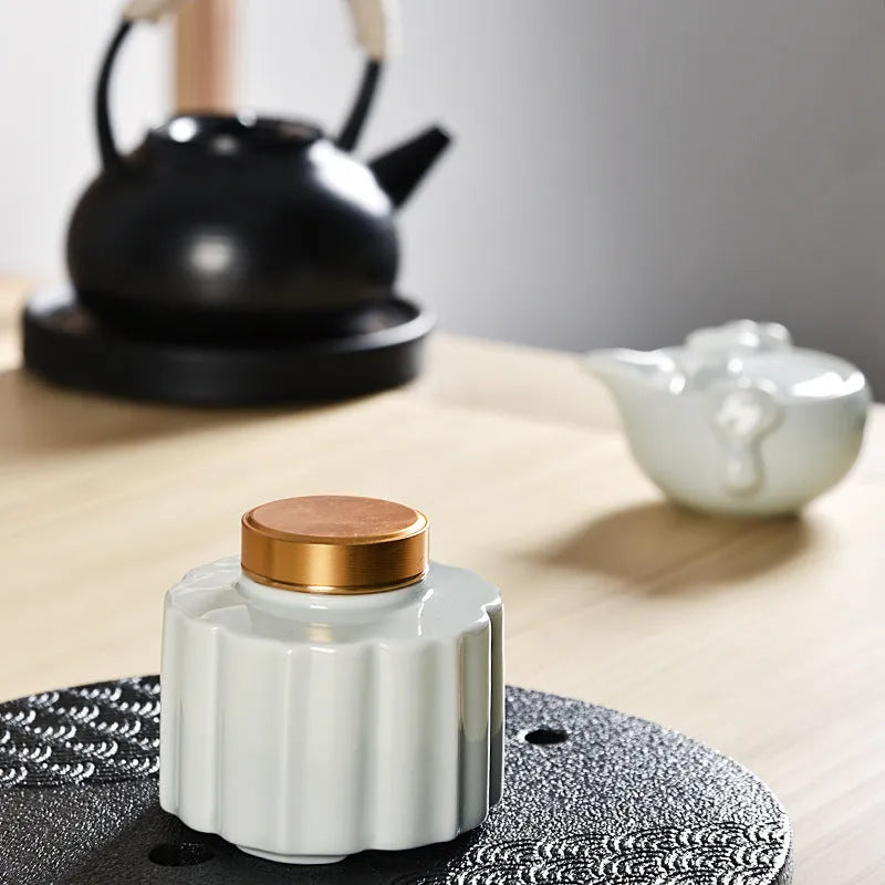 Ceramic tea pot storage tank with coloured glaze and lotus leaf motif in multiple colour options
