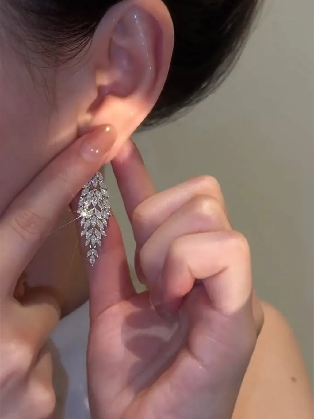 Silver anti-allergy auricular needle earrings with Japanese Korean style New Year design on alloy base