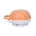 Orange TPR pet bath brush with shampoo dispenser and silicone bristles for dog and cat grooming