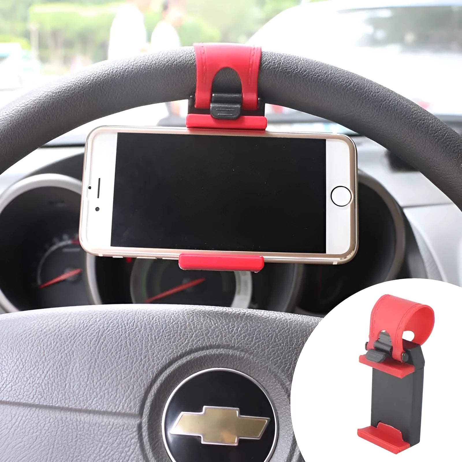 Black universal steering wheel phone holder clip mount attached to a car steering wheel.