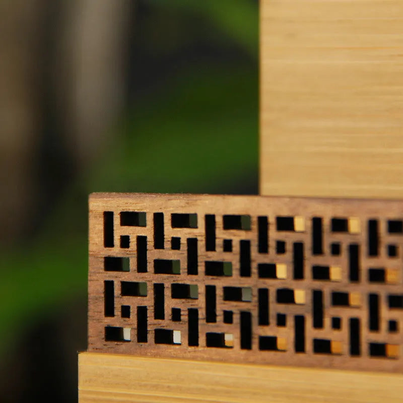 Geometric business card case in bamboo and black walnut wood with 80-card capacity