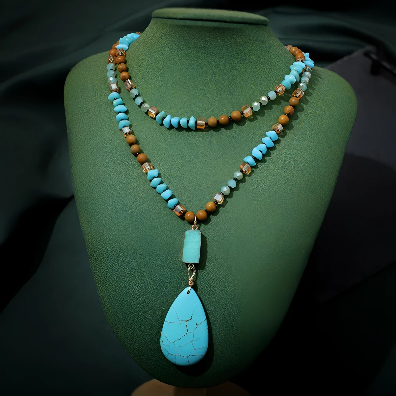 Blue turquoise gem inlaid drop pendant on a long ball bead necklace chain