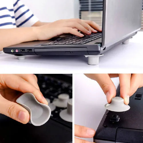 Grey durable plastic laptop cooling pads, two large and two small, on a table.