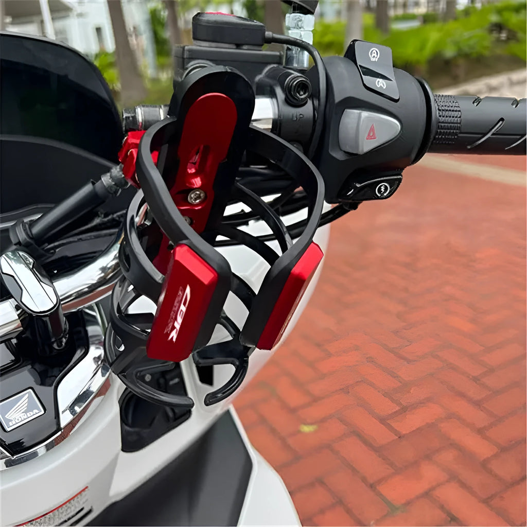 A black water bottle cage designed for mounting on a Honda X-ADV scooter bumper.