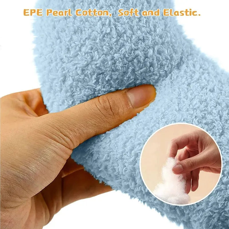 Blue U-shaped plush pet pillow for a small dog or cat, showing raised rim and quilted texture.