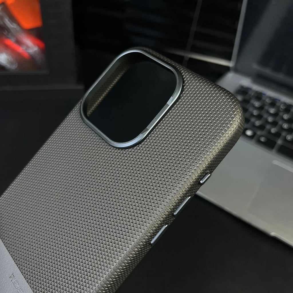 Black magnetic iPhone case with dragon scale texture and leather-like stitching, shown on an iPhone 15 Pro Max.