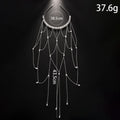 Gold electroplated mesh hair chain for women with pearl beads and a dangling tassel detail.