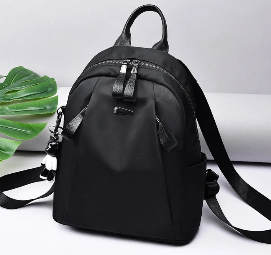 Medium Oxford cloth rucksack with multiple compartments showing mobile phone pocket and ID holder