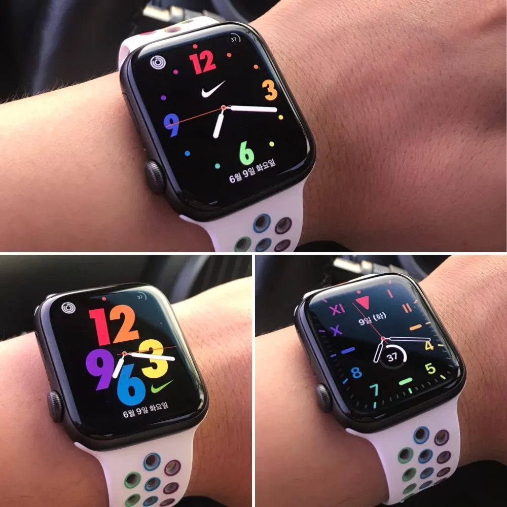 A black silicone sports wristband with a silver buckle clasp, shown on a wrist.
