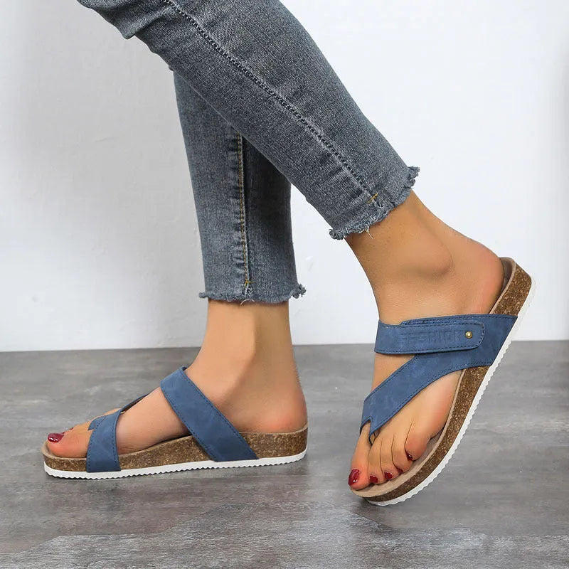 Women's blue flat toe ring thick-soled flip-flops with artificial PU upper on a plain background