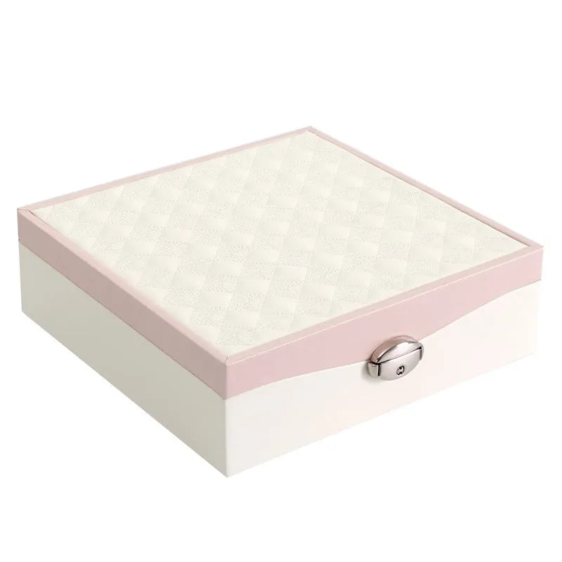 Red PU leather jewellery storage box for necklaces and rings on a dresser