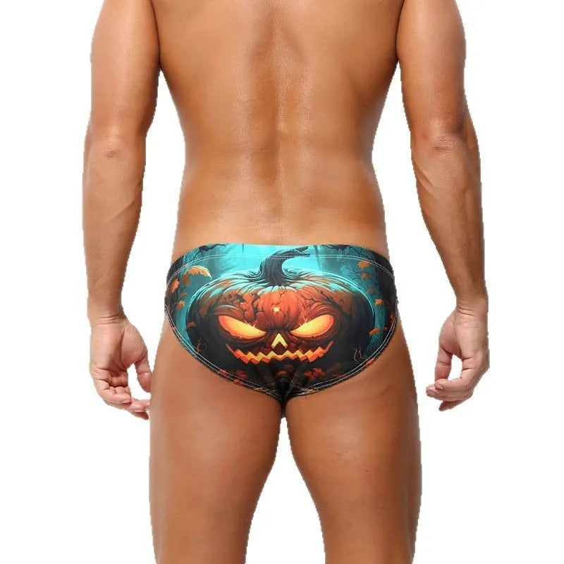 Man wearing quick-drying digital print polyester shorts in a low waisted briefs style.