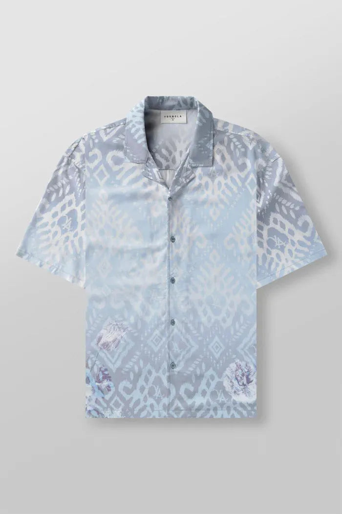 A loose-fitting short sleeve casual top with a floral print, shown in a light colour on a male model.