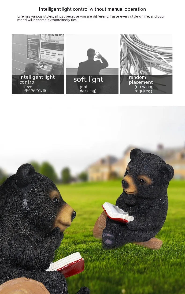 Black bear solar light ornament in synthetic resin placed in garden with solar panel on top