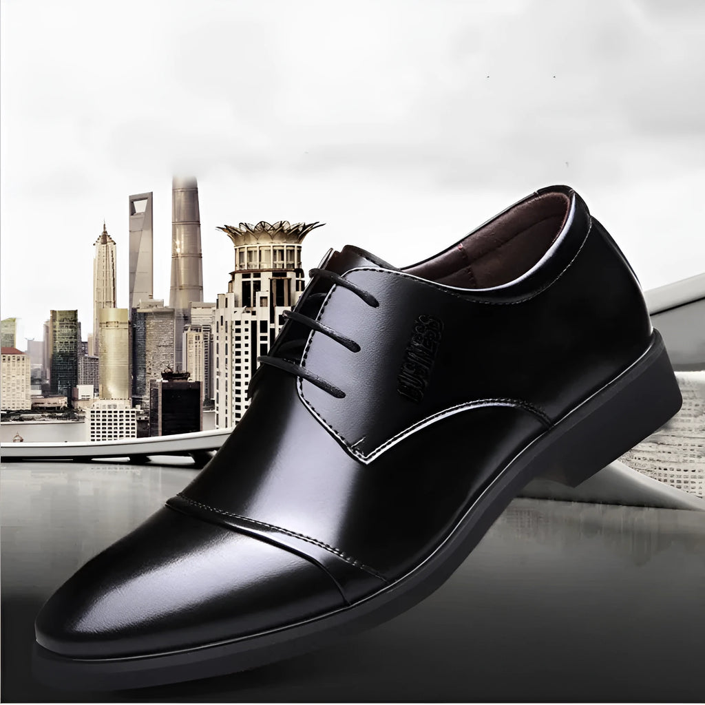 Men's black formal lace-up leather shoes with stitching detail, shown on a white background.