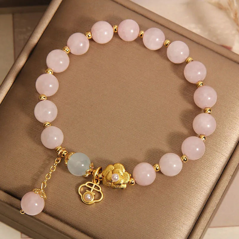 Women's pink crystal flower bracelet with refined graceful design on wrist