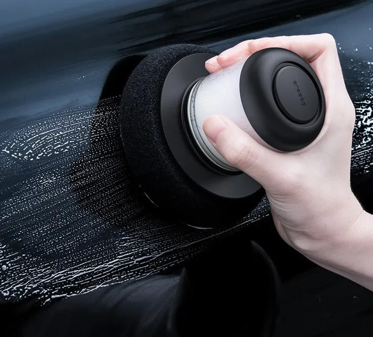 Dual-action car polishing machine with 6 speed settings in black ABS PC body with sponge pad attached
