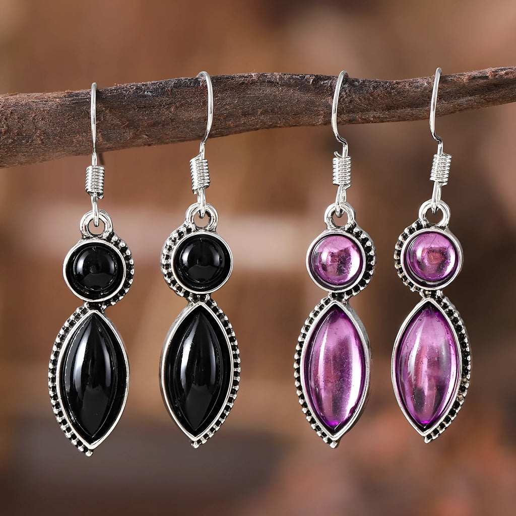 A pair of vintage geometric pendant earrings in black and purple with a Bohemian style.