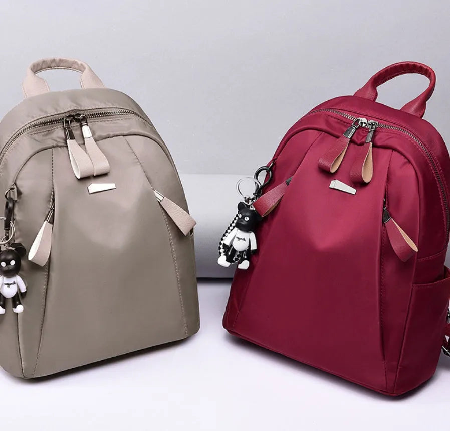 Medium Oxford cloth rucksack with multiple compartments showing mobile phone pocket and ID holder