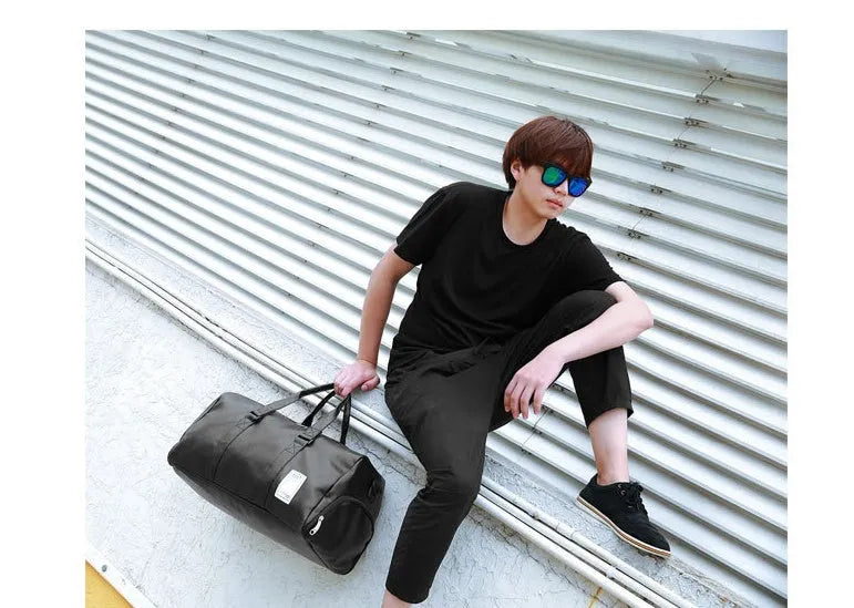Black waterproof sports fitness bag with a separate shoe compartment, shown in two size options.