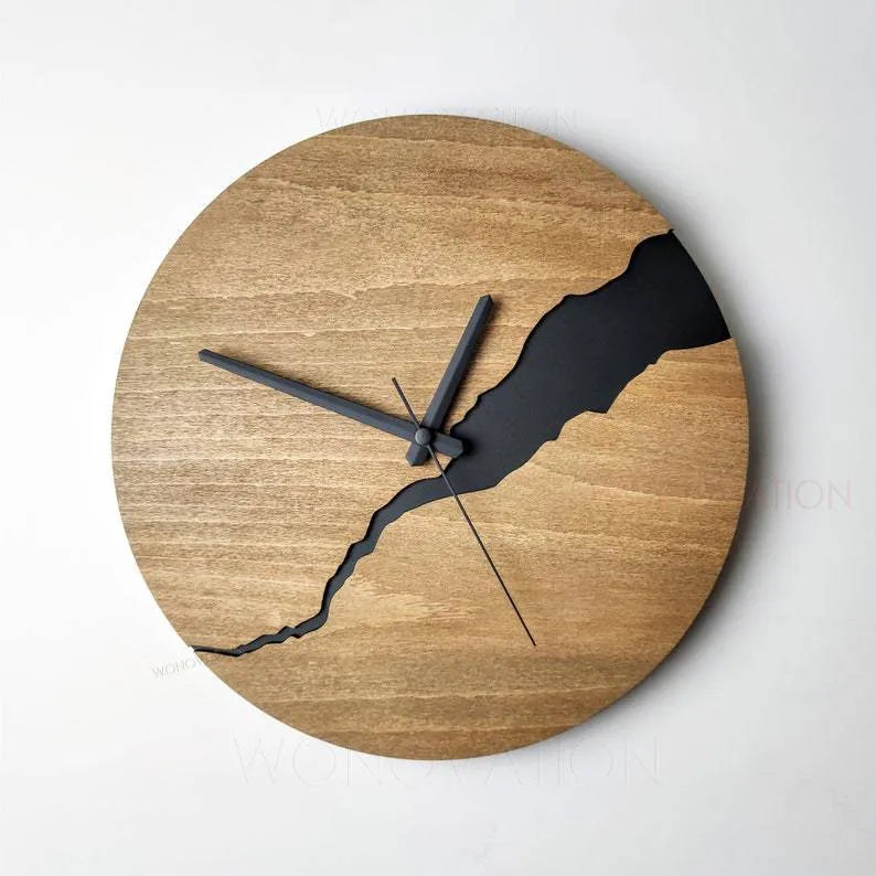 Modern wooden wall clock with a white crack design on a coloured background.
