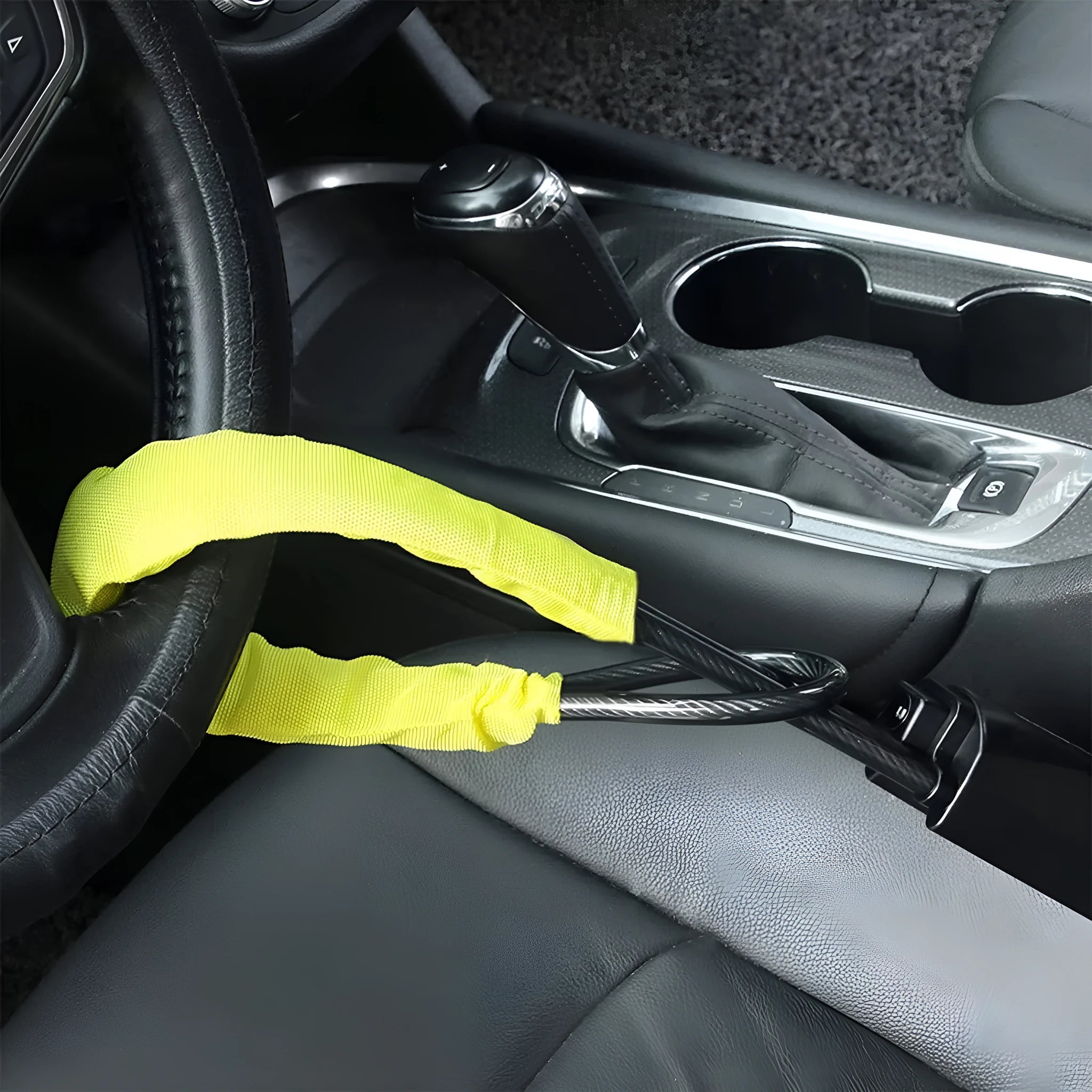Red iron wire rope car steering wheel lock with key for General Motors vehicles.