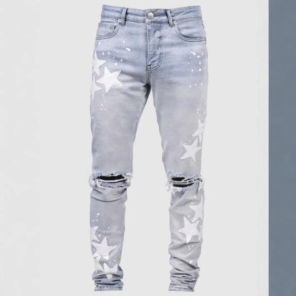 Men's slim fit stretch jeans in blue with mid waist and subtle embroidery detail on denim.