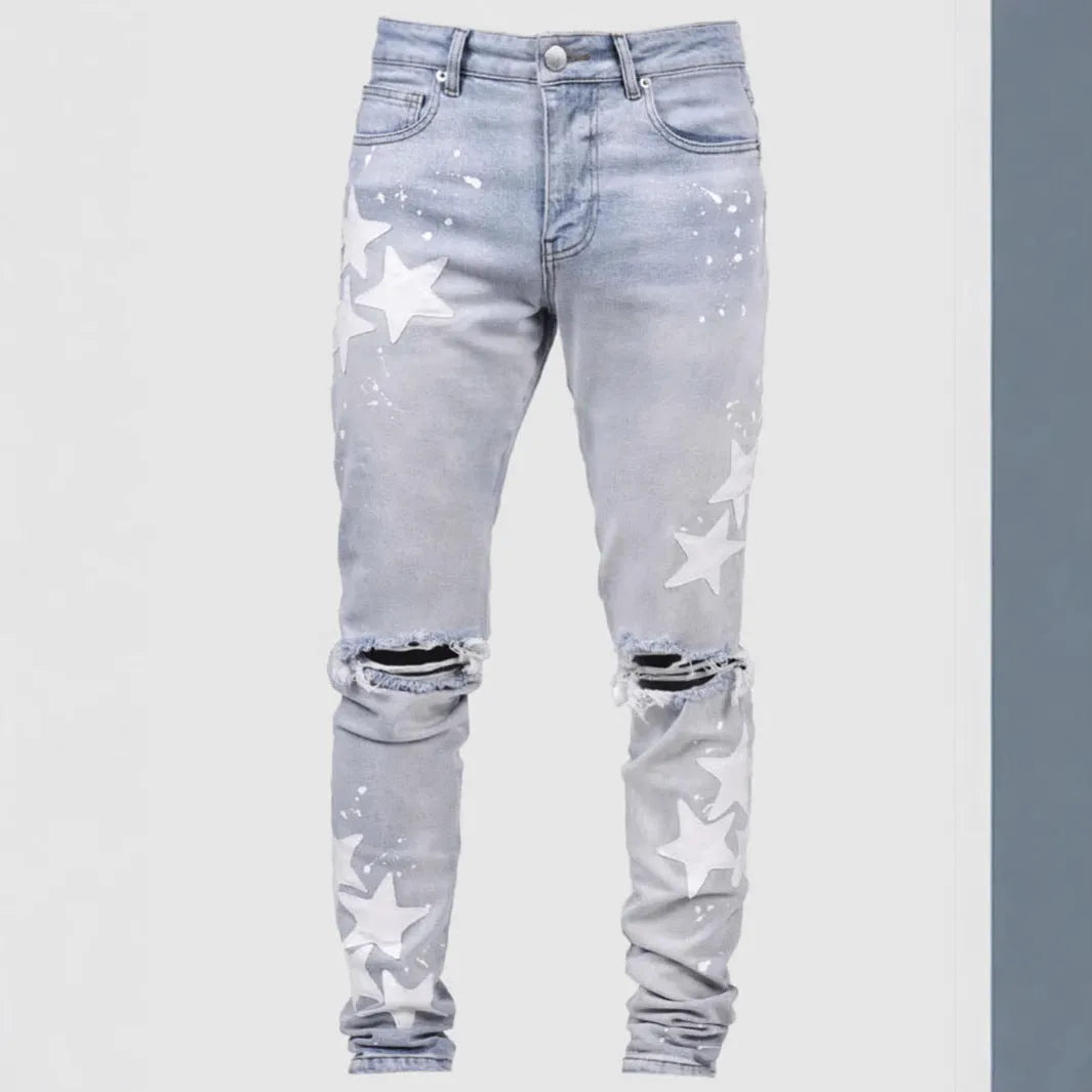 Men's slim fit stretch jeans in blue with mid waist and subtle embroidery detail on denim.