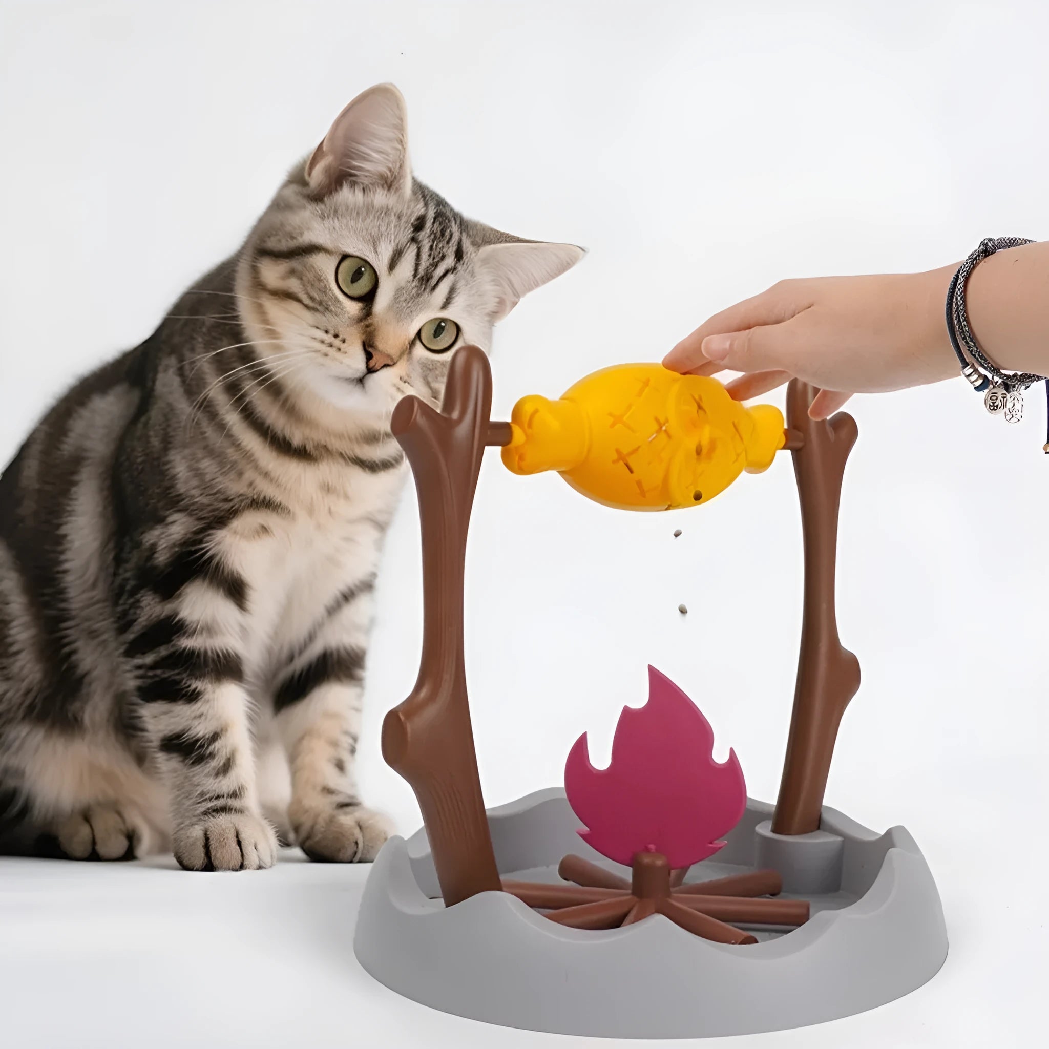 Barbecue-style tumbling cat feeder toy with food compartment, measuring 30x30x29cm.