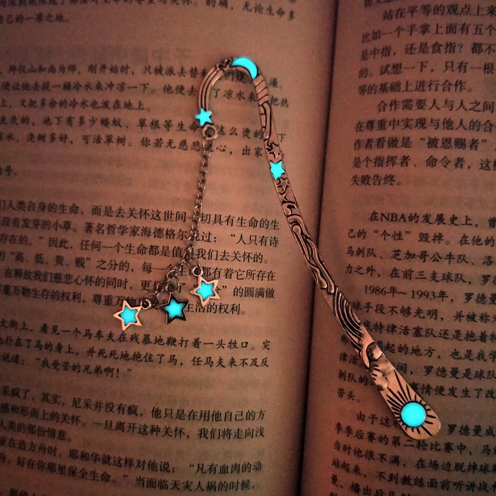 Retro five-pointed star metal bookmark glowing with celestial sun moon stars design