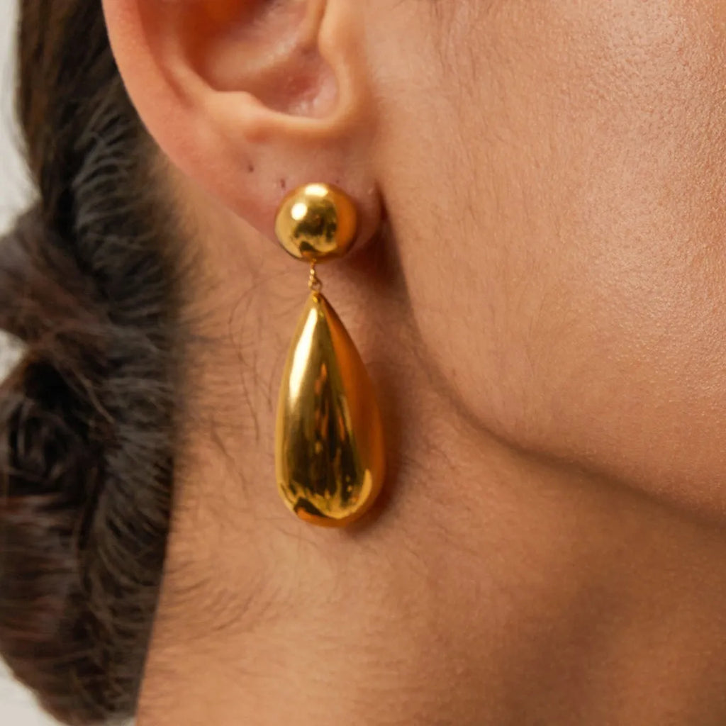 Gold stainless steel water drop shaped hemisphere pendant earrings for women.