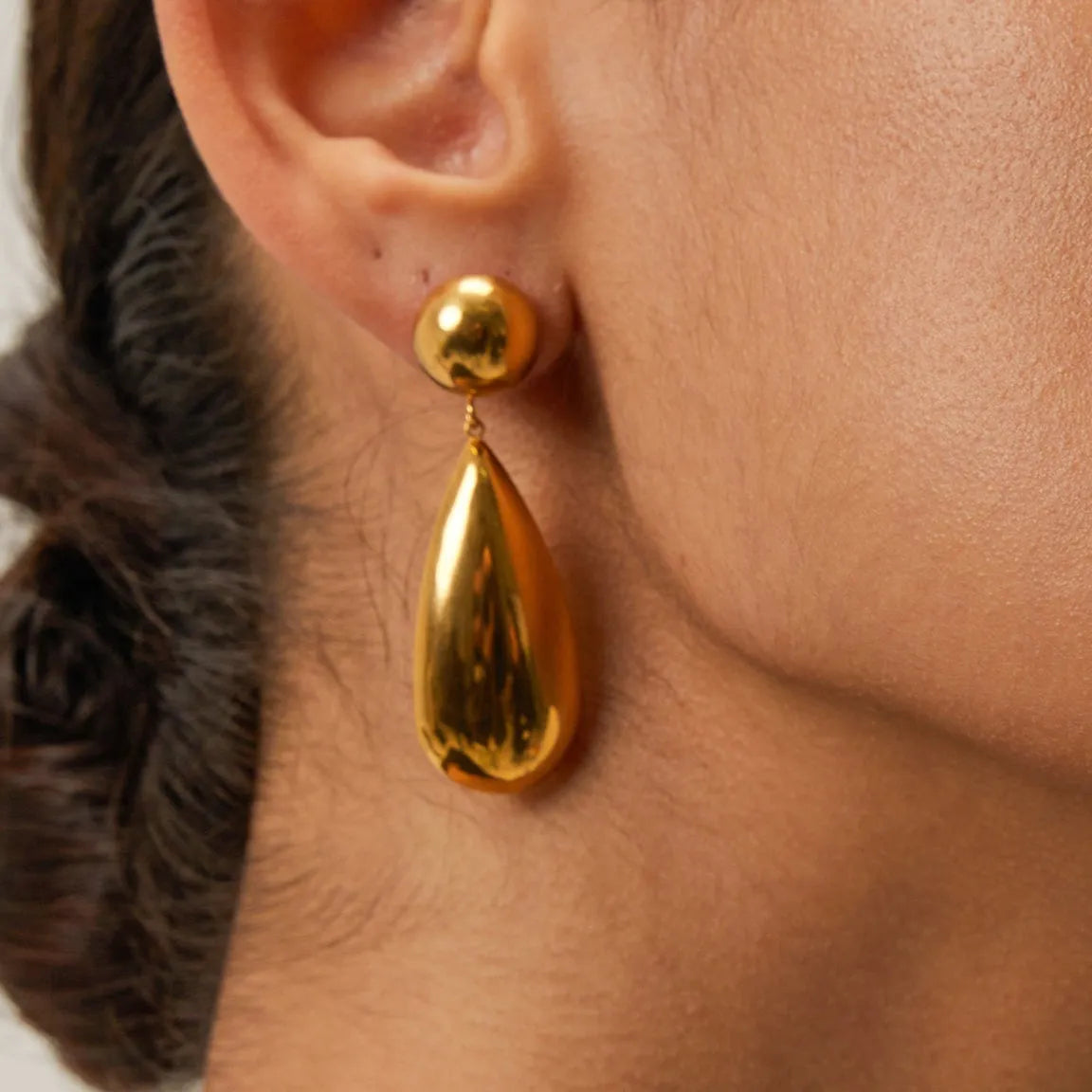 Gold stainless steel water drop shaped hemisphere pendant earrings for women.