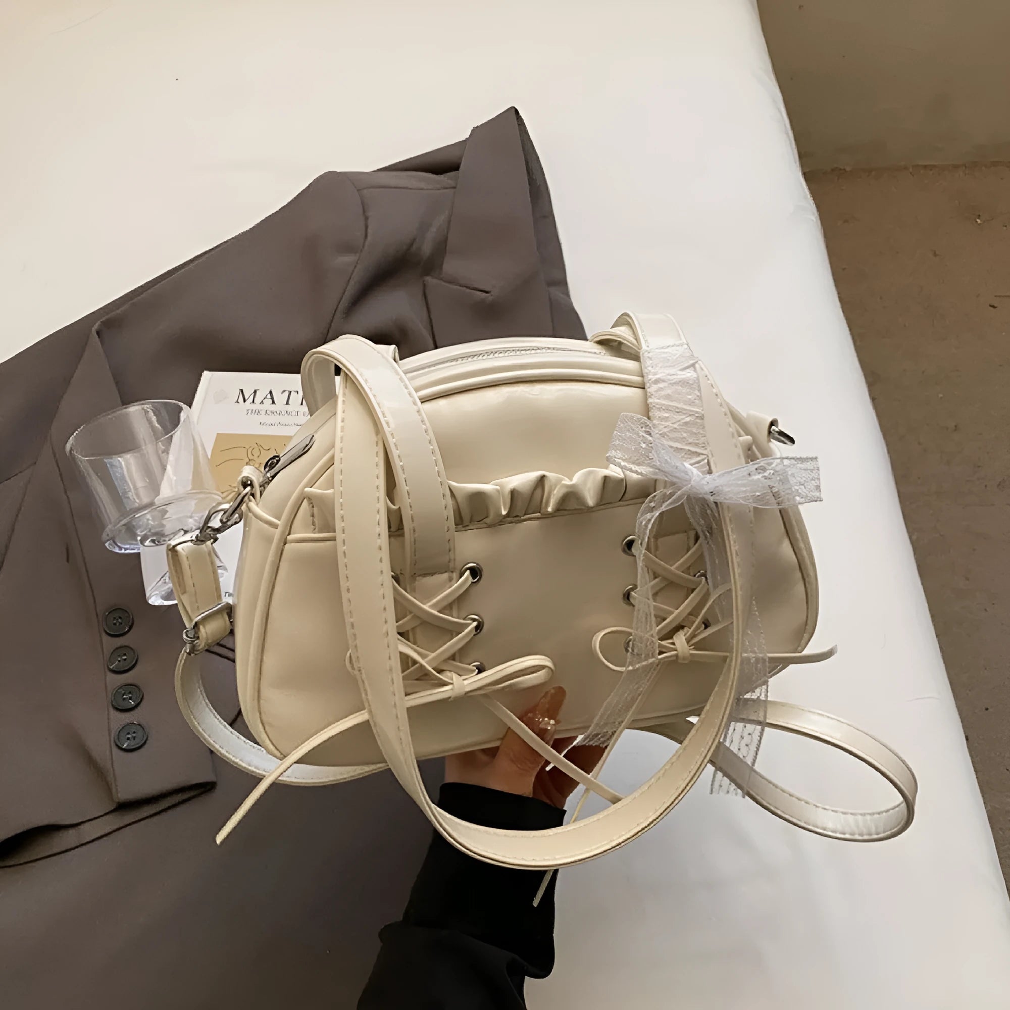 Women's casual shoulder handbag with bandage bow detail and PU leather in milky white colour