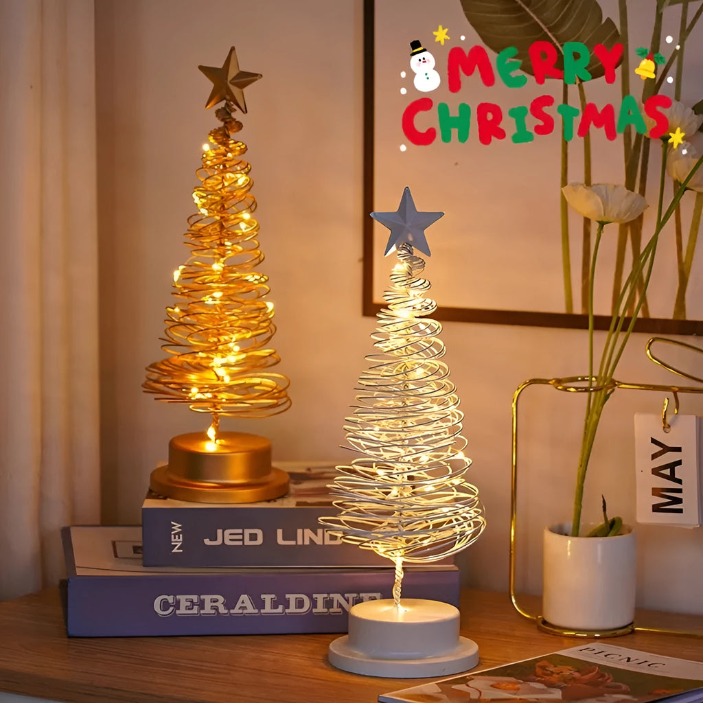 Wrought iron LED Christmas tree light with spiral design and warm white illumination on table