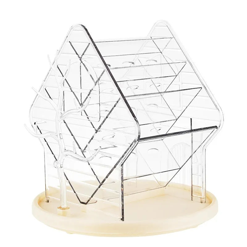Rotating amber gold cosmetics organiser on a vanity with makeup bottles.