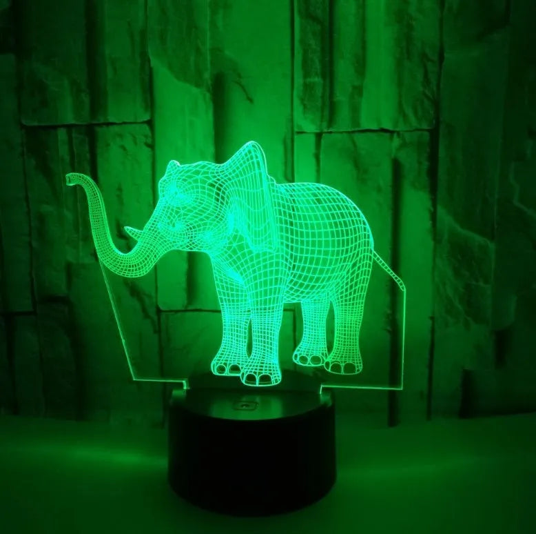 3D LED elephant touch lamp showing seven colour modes on a wooden desk