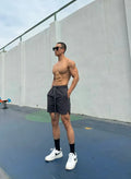 Men's ice silk quick-drying shorts in quarter length, shown in multiple colours.