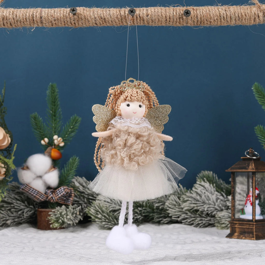 Cartoon angel cloth hair clip for a girl's Christmas ponytail in khaki, pink, or white.