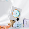 White wall-mounted automatic essential oil diffuser with USB charging port.