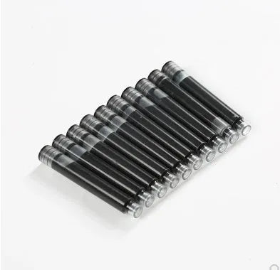 Ten steel ink sacs for fountain pen repair laid out on a surface.