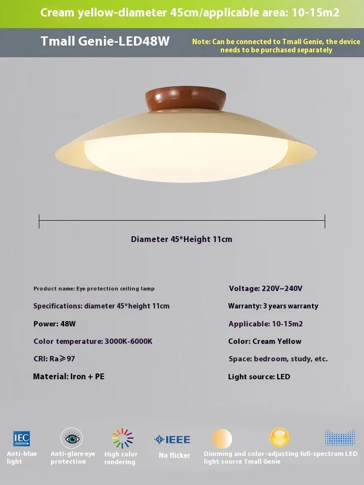 Modern cream-style flying saucer ceiling lamp in a minimalist room setting.