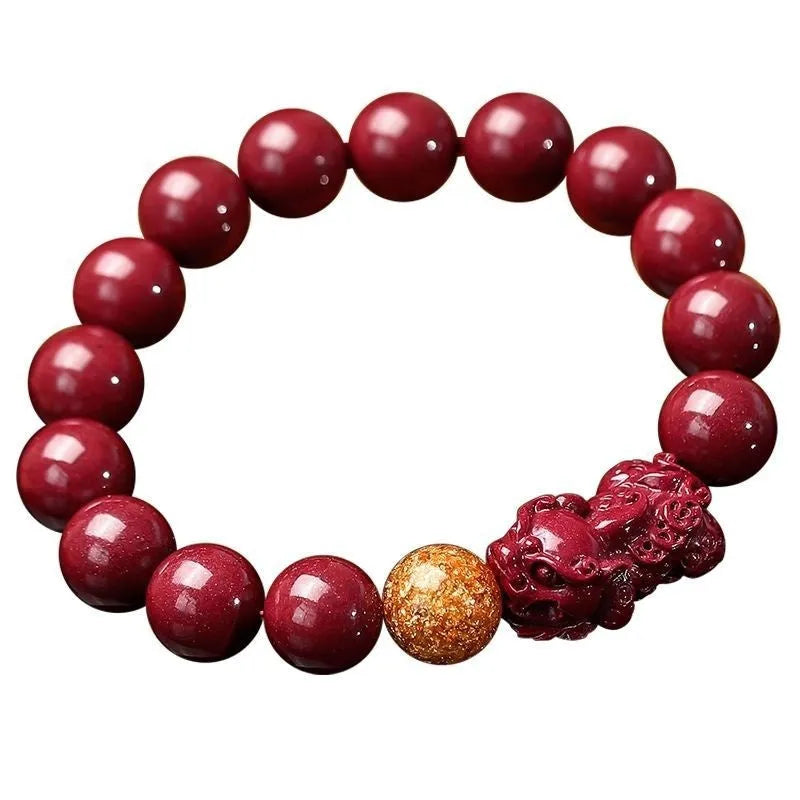 Purple gold sandstone cinnabar bracelet with totem elements on a wrist.